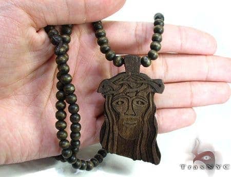 black wooden jesus piece